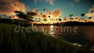 空中气球飞过美丽的湖泊和被群山环绕的绿色草地，日出旅行镜头
